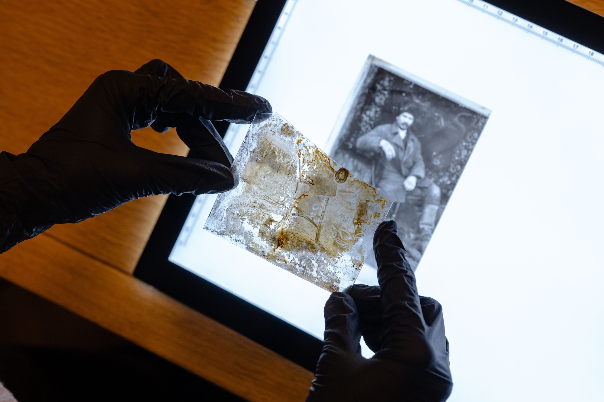 Glass negative and its copy on film. Photo by Bohdan Yemets / Lviv Center for Urban History
