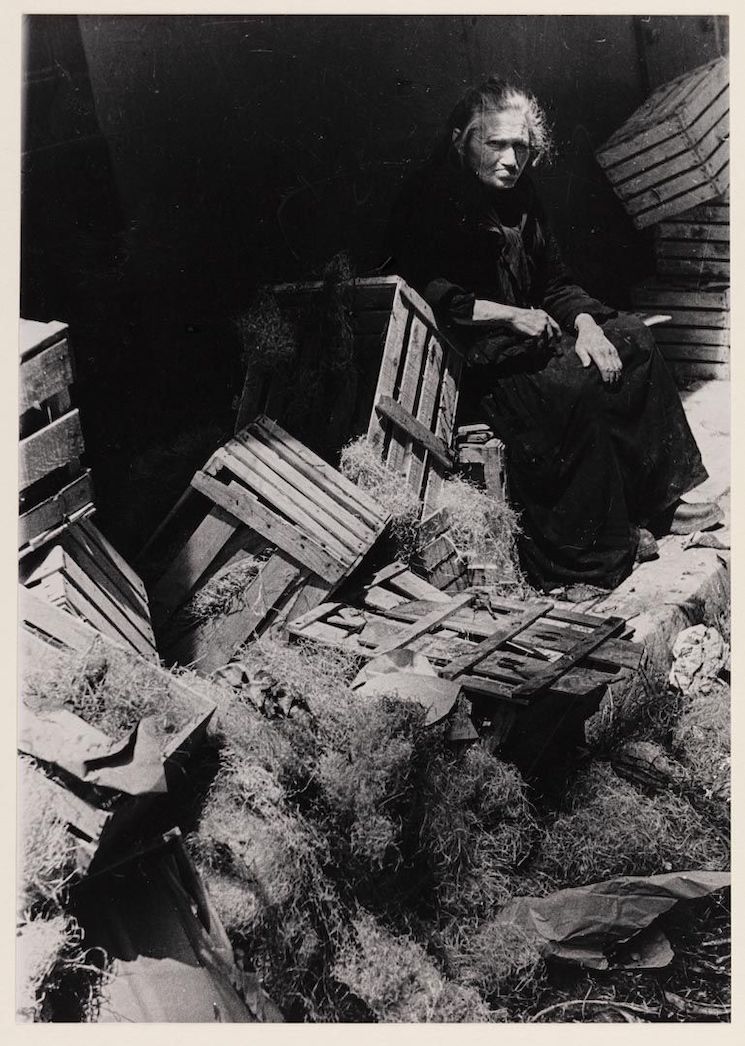Julia Pirotte. A woman sitting on wooden boxes, Marseille, 1942 / Jewish Historical Institute